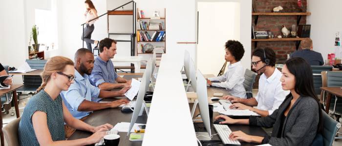 Multiple people working on their computers