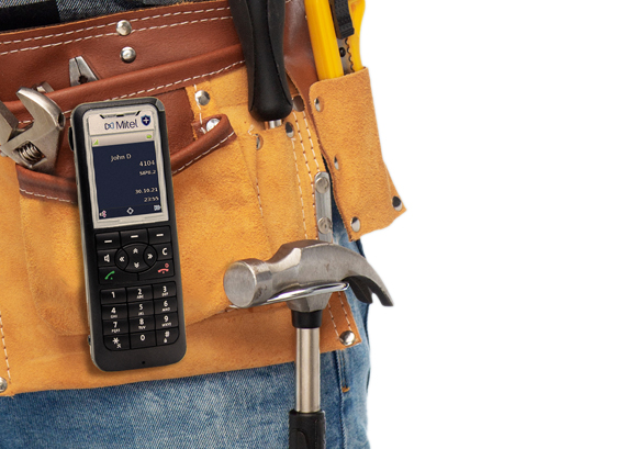 A worker with a phone attached to his belt 