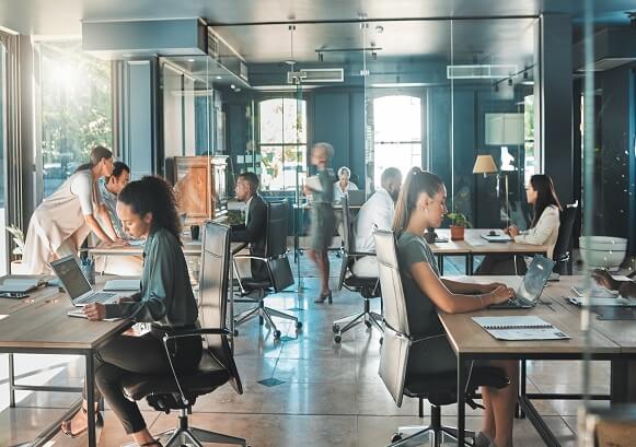 Multiple people working in an office