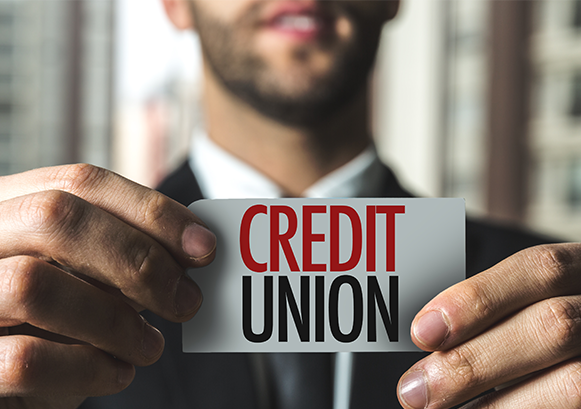 Credit Union sheet of paper holded by a man