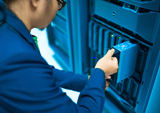 Person removing server from cabinet