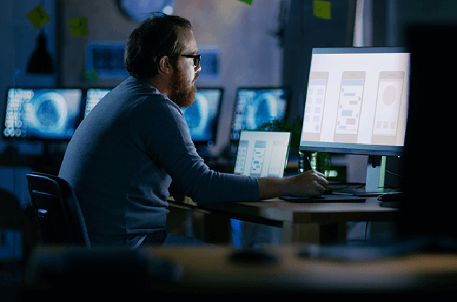 Man on desktop screen