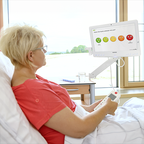 Woman in hospital bed with HiMed Screen